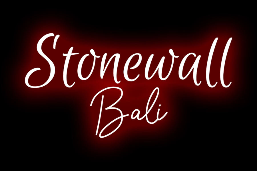 White cursive “Stonewall Bali” logo on a red glowing background.